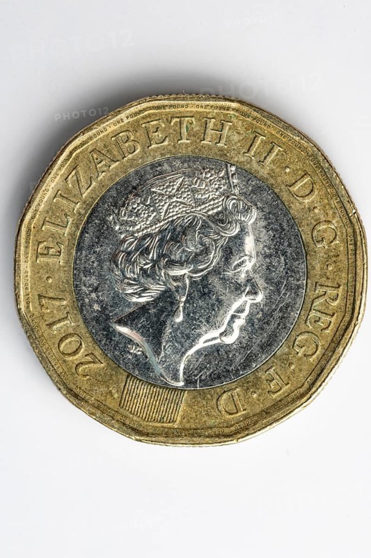 Close-up of the obverse of a British one pound coin, white background