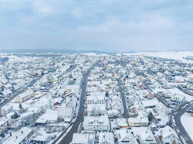 Aerial view of a snow-covered town, streets and roofs clearly visible, Deckenpfronn, Böblingen district, Germany