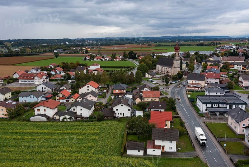 Drone shot, view of village with church, Burgkirchen, Innviertel, Upper Austria, Austria