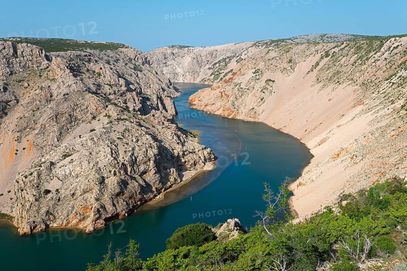 A deep river meanders through rocky cliffs under a clear sky, Pariževacka Glavica, Parizevacka, location of Karl May films, Zrmanja River, Jasenice, Zadar County, Croatia