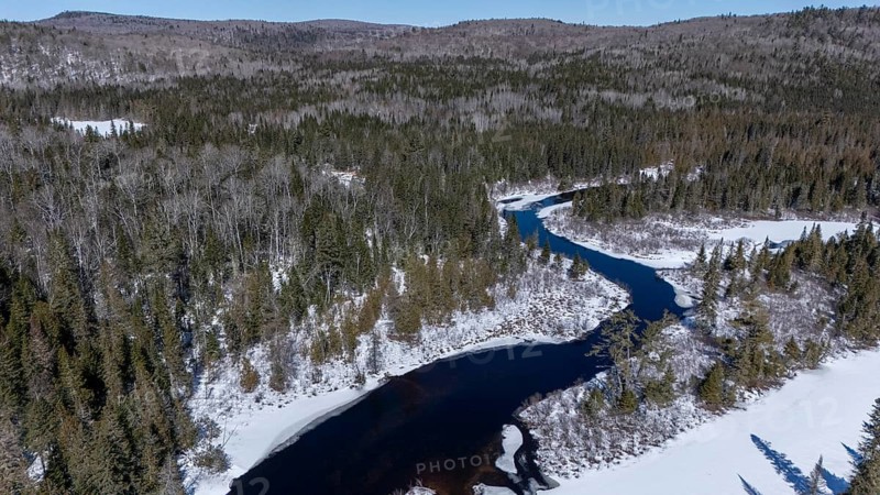 Wolf river. unfrozen part of the river in winter. Mastigouche wildlife reserve.. Province of Quebec. Canada