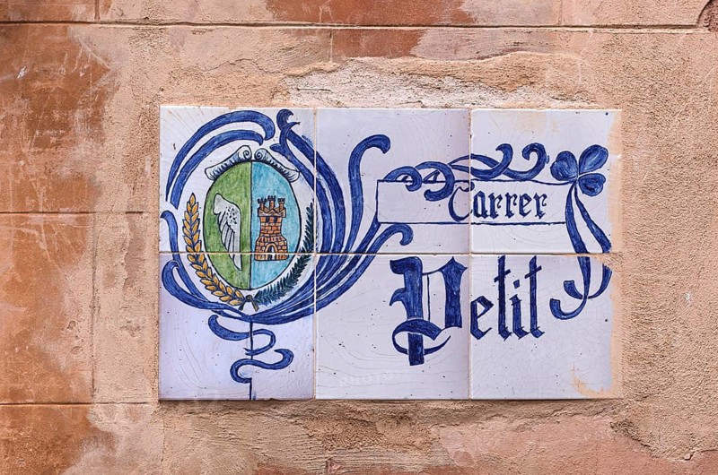 Traditional street sign made of painted tiles, Carrer Petit, Alaró, Calvià, Majorca, Balearic Islands, Balearic Islands, Spain