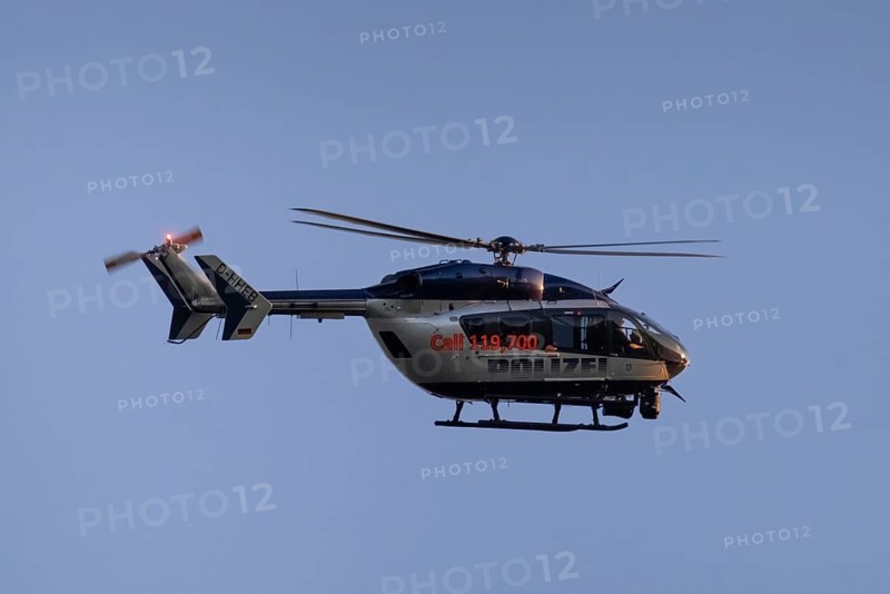 A police helicopter circles in the air over Frankfurt am Main, Frankfurt am Main, Hesse, Germany