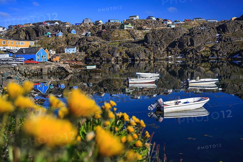 Inuit settlement, village and boats by the sea off Bergen, sunny, Sisimiut, West Greenland, Greenland