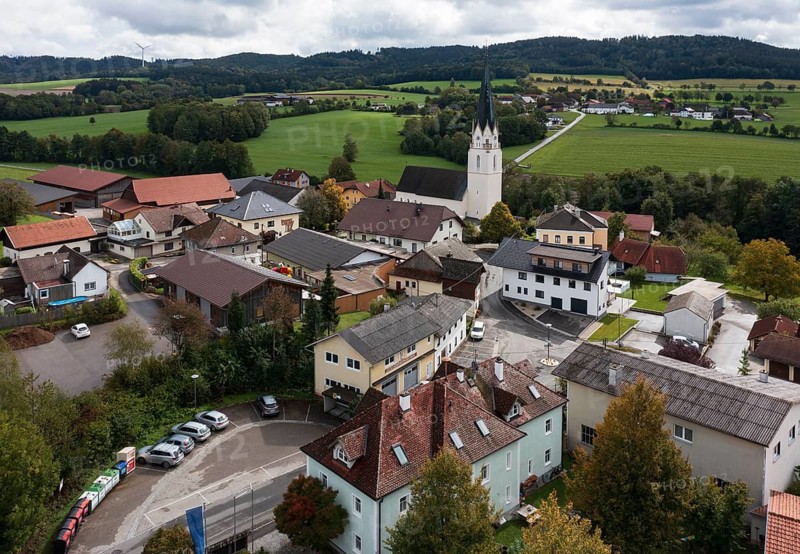 Drone shot, view of village with church, Sankt Marienkirchen am Hausruck, Hausruckviertel, Upper Austria, Austria