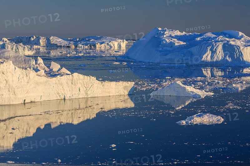 Icebergs and ice floes reflected in the water, summer, midnight sun, Jakobshavn glacier and ice fjord, Ilulissat Kangerlua, Disko Bay, West Greenland, Greenland