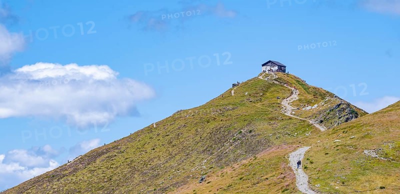 Helmhaus mountain hut on a mountain peak, Carnic High Trail, Carnic Alps, Carinthia, Austria