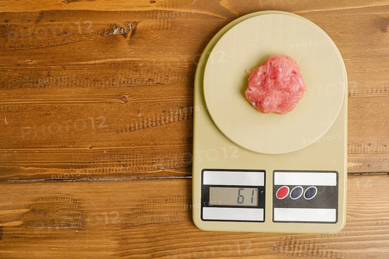 Top view of minced meat on a kitchen scales