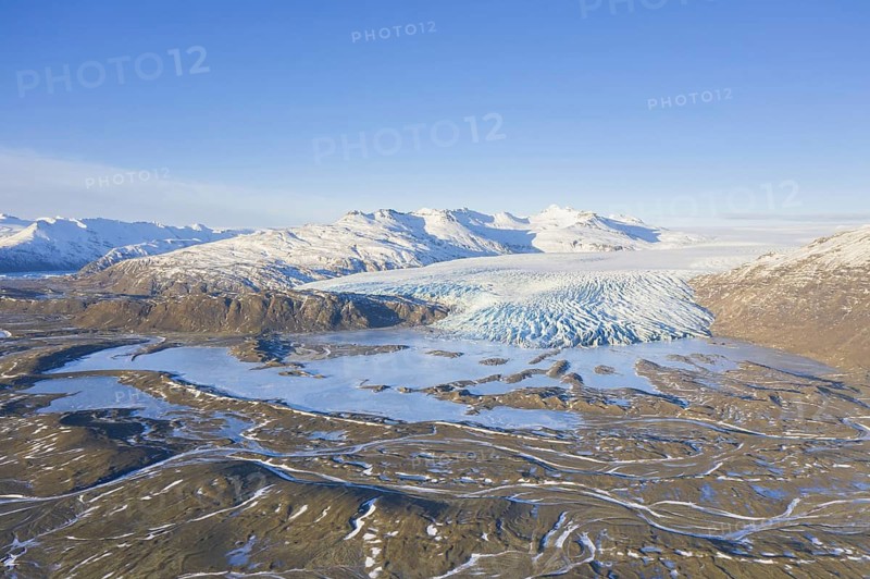 Aerial view over ice tongue Falljökull in winter, one of many outlet glaciers of Vatnajökull, Vatna Glacier, largest ice cap in Iceland, Austurland