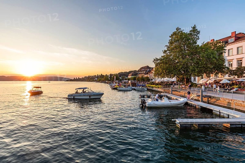 Motorboats and restaurants on the lakeside promenade in Überlingen, Lake Constance, Baden-Württemberg, Germany