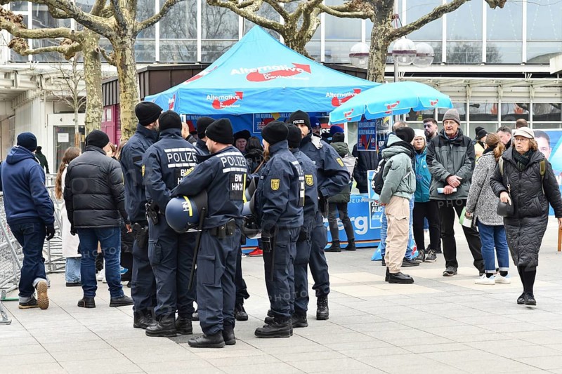 Heidelberg, Germany - February 12th 2025: Election booth of far right political party AfD surround by police