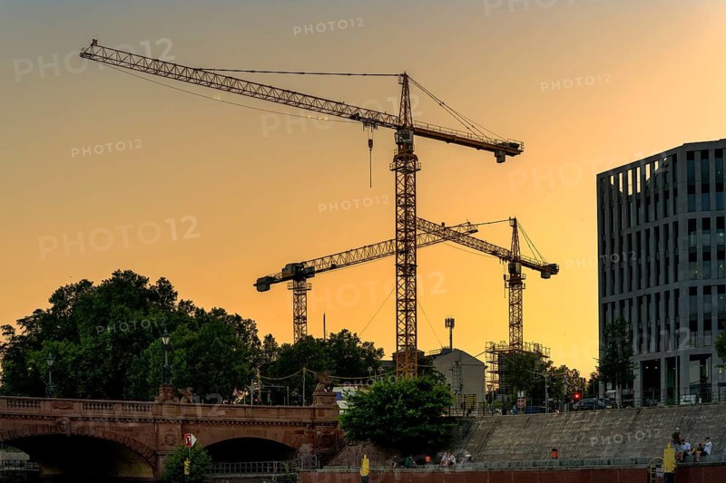 Evening sun, construction cranes around Berlin Central Station, Berlin, Germany