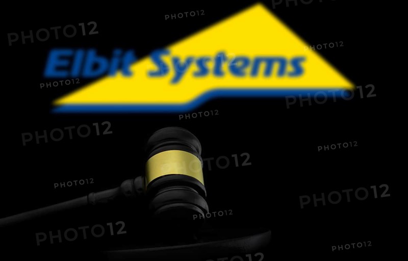 Court gavel in front of the Elbit systems logo. Elbit Systems Ltd is an Israel based international military technology company