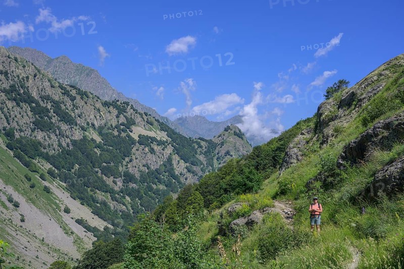Woman standing on hiking trail to Lago del Vei del Bouc, Entracque, Province of Cuneo, Italy