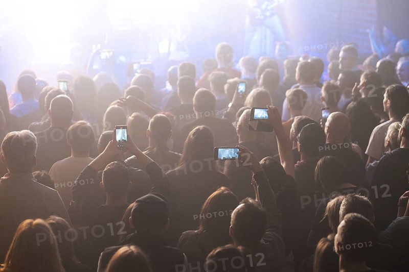 Crowd of people in front of the stage during the concert