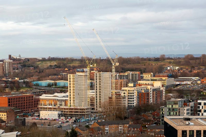 Large cranes RWInvest construction site Legacie 'The Gateway' housing development, Vauxhall, Liverpool, England, UK