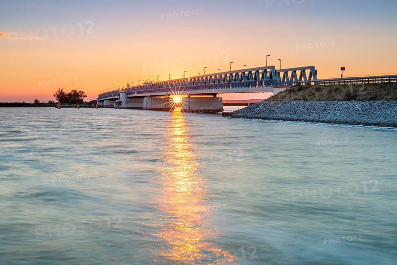 Sunset on the Peene River, bascule bridge to the island of Usedom, Mecklenburg-Western Pomerania, Germany