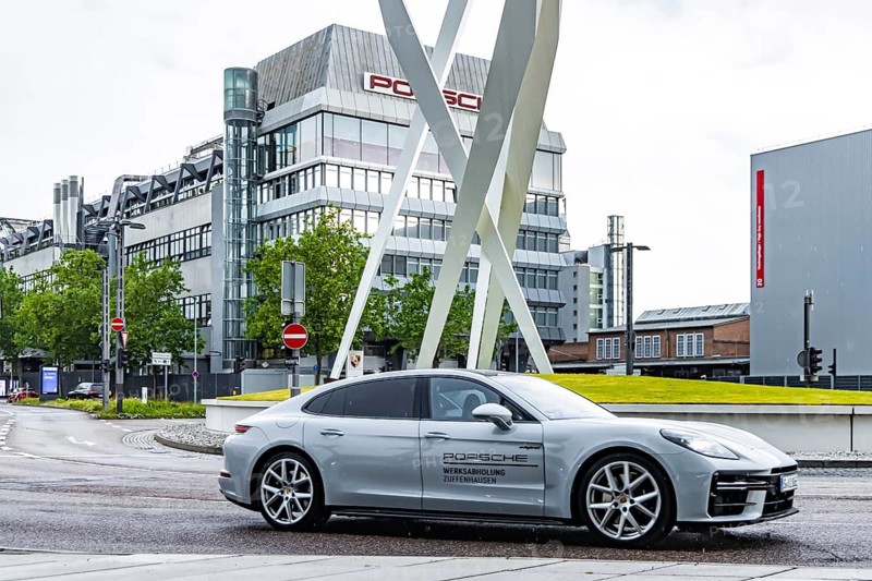 Porscheplatz Zuffenhausen with Porsche headquarters. Artwork Inspiration 911 by Gerry Judah with three steles, each presenting a Porsche 911. Stuttgart, Baden-Württemberg, Germany