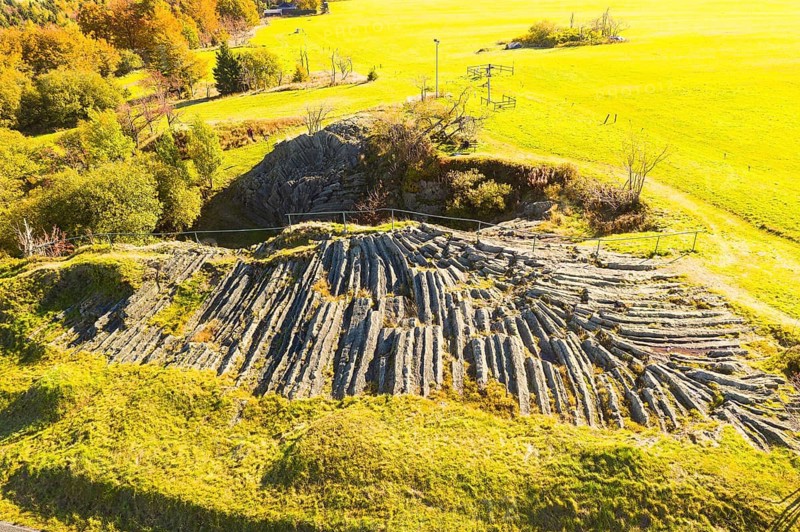 Aerial view of the fan-shaped basalt outcrop of the former quarry on the Hirtstein, called Basaltfächer or Palmwedel, Marienberg, Erzgebirge, Saxony, Germany