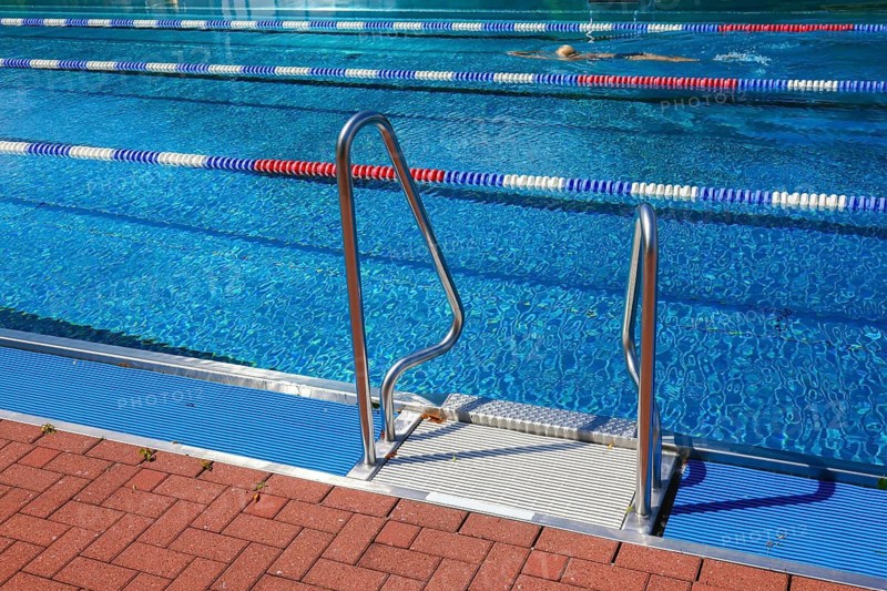 Hagen, North Rhine-Westphalia, Germany - Ladder at the edge of the swimming pool in the Hengstey outdoor pool