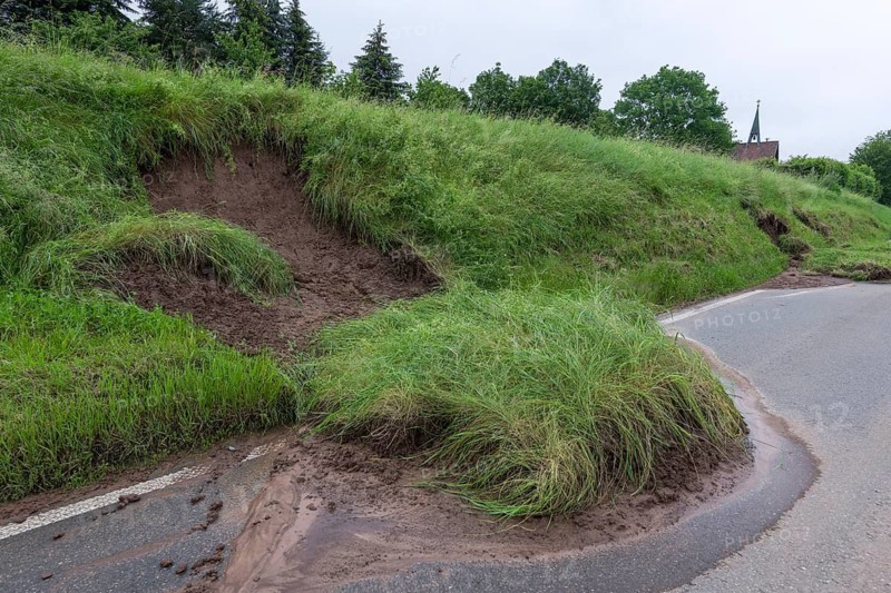 Symbolic image of climate change, slippery slope on a country road after heavy rainfall, near Berglen Hößlinswart, Baden-Württemberg, Germany