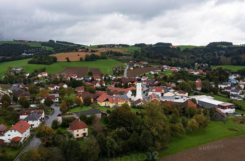 Drone shot, view of village with church, Enzenkirchen, Innviertel, Upper Austria, Austria
