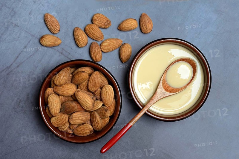 White almond cream in small bowls, almond butter