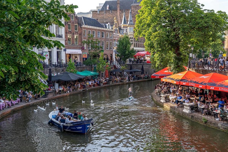 The old town centre of Utrecht, Oudegracht, around 2 km long with many old houses, shops, restaurants directly on the canal, many bridges, boat traffic of all kinds, canal cruise, Netherlands