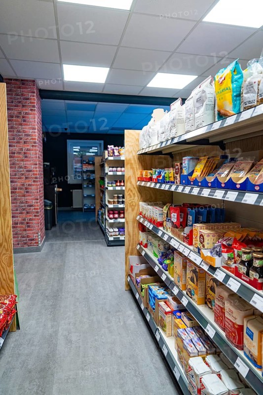 Modern supermarket with well-stocked shelves and light-coloured wooden floor, Tante M, self-service shop, Enzklösterle, Calw district, Black Forest, Germany