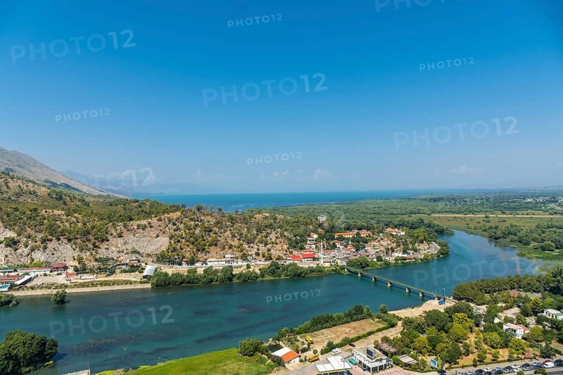 The walls of Rozafa Castle and its citadel in the city Shkoder along the lake river. Albania