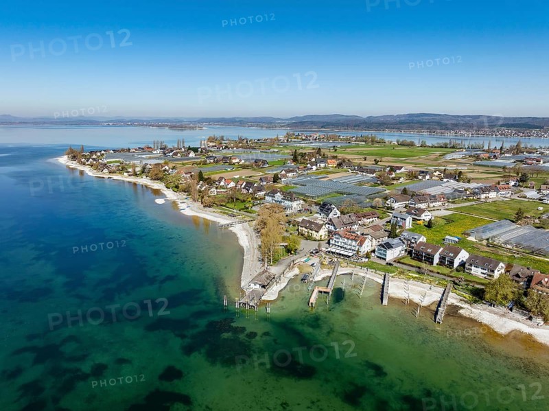 Aerial view of the southern part of the island of Reichenau at low tide and spring-like vegetation, with the landing stage and boat harbour, district of Constance, Baden-Württemberg, Germany