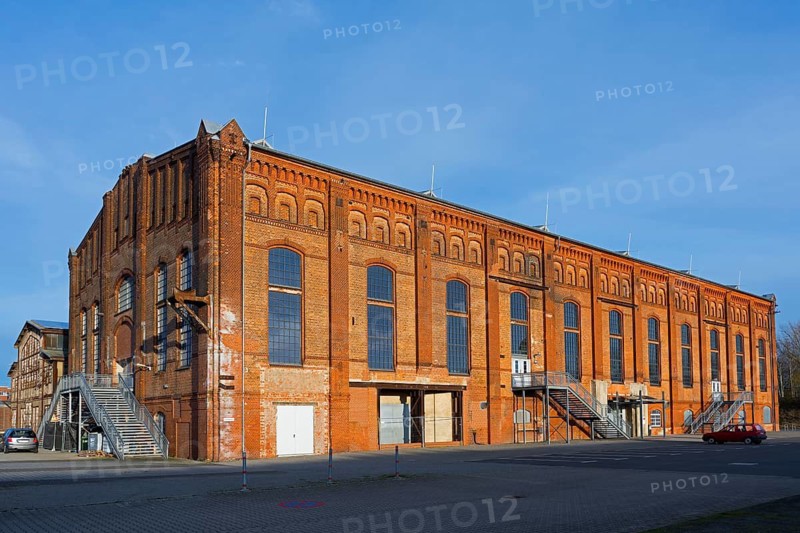 Large, old brick factory building with large windows under a clear sky, blowing hall, Ilseder Hütte, Ilsede, Peine, Lower Saxony, Germany