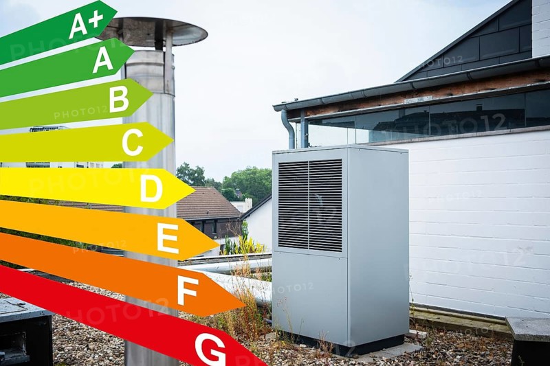 Graphic with energy efficiency classes, a heat pump on the roof of a house in Düsseldorf, Germany
