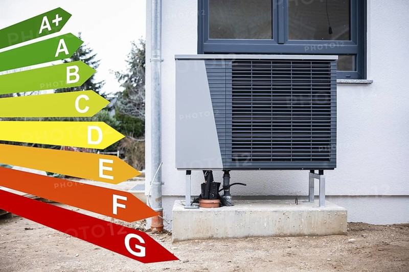 Heat pump on a new single-family house, graphics with energy efficiency classes according to the GEG in Düsseldorf, Germany