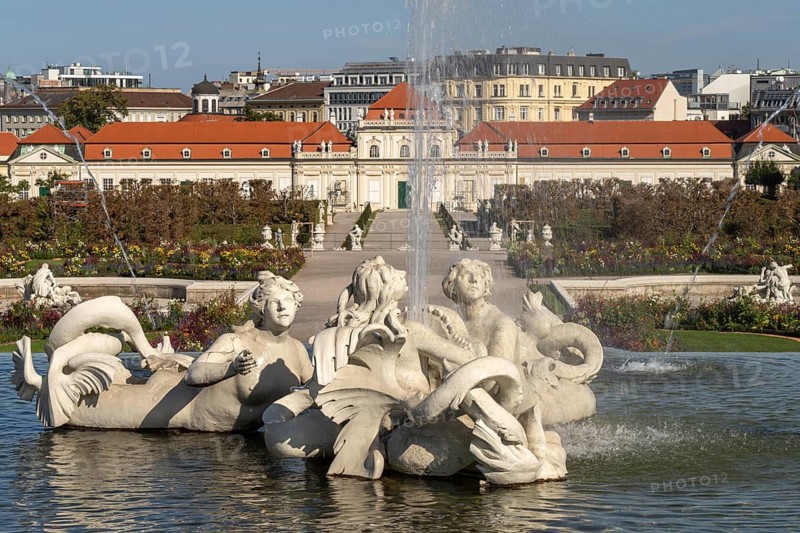Fountain in the palace gardens and the Lower Belvedere in Vienna, Austria