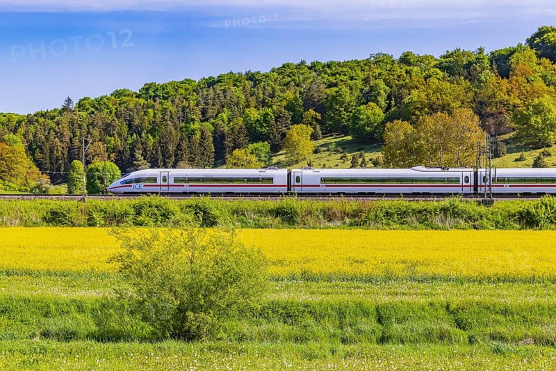 InterCityExpress ICE travelling across the Swabian Alb. Idyllic landscape in spring. Lonsee, Baden-Württemberg, Germany