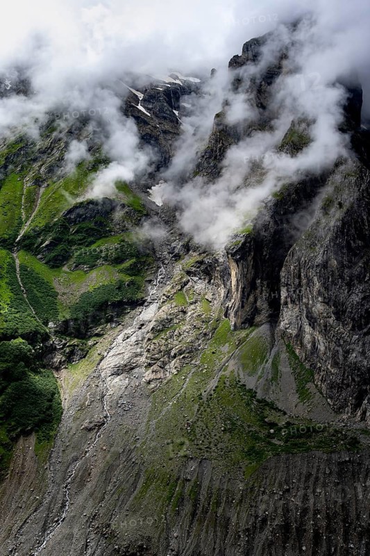Dramatic mountain landscape covered in clouds, Bernese Alps, Bernese Oberland, Switzerland