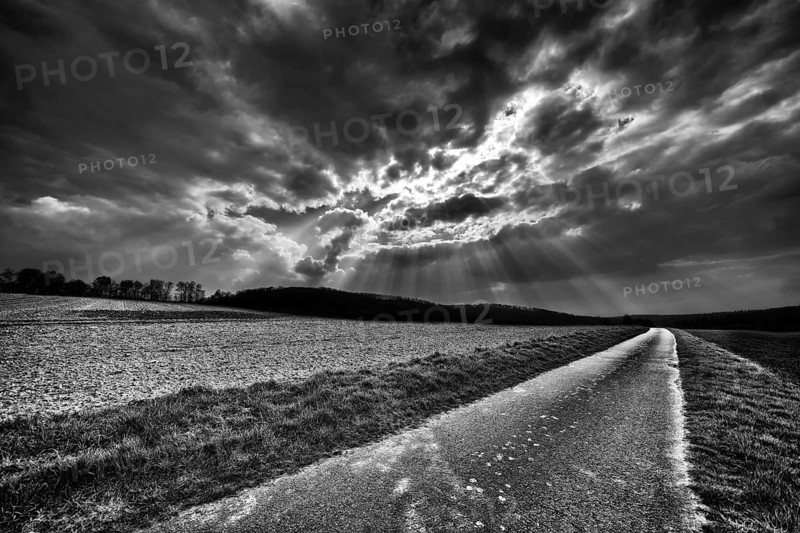 Bike path R1 with a dramatic cloudy sky, near Wesertal, Weser Uplands, Weserbergland, Hesse, Germany, digitally edited