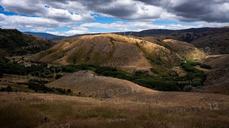 Landscape in New Zealand. View from Lindis Pass Tarras Road towards Cluden Creek Road. Lindis Valley, Otago, South Island, New Zealand
