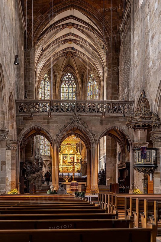 St. Dionys Town Church. interior view. Crucifixion scene on the high altar created in 1604. Three-storey winged altar by Peter Riedlinger and David Mieser. City view of Esslingen am Neckar, Baden-Württemberg, Germany