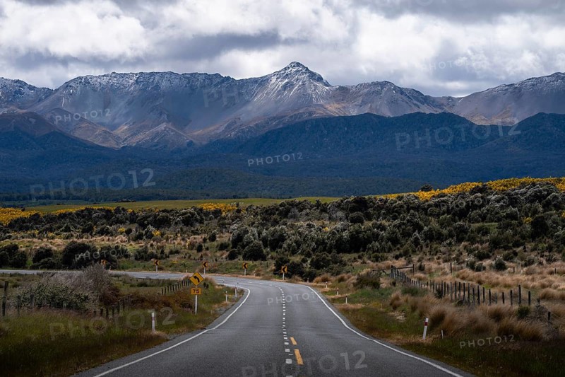 Landscape with mountains and road, Milford Road between Te Anau and Milford Sound. Fiordland National Park, Southland Region, South Island, New Zealand