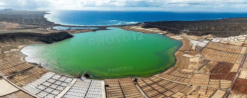 Salt mining plant, Salinas de Janubio with green Laguna de Janubio, near Yaiza, aerial view, Lanzarote, Canary Islands, Spain