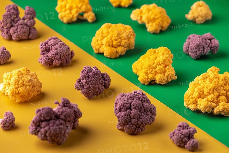 Colourful cauliflower on a yellow and green background
