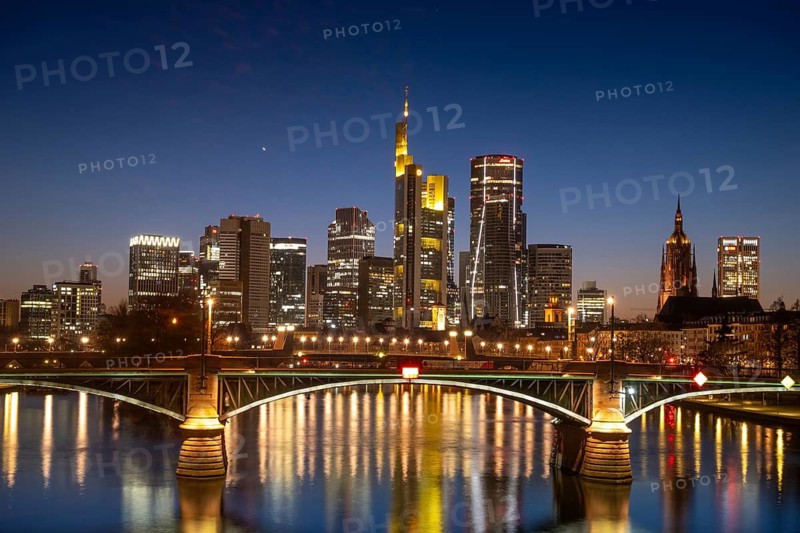The lights of Frankfurt's banking skyline glow in the evening, Frankfurt am Main, Hesse, Germany