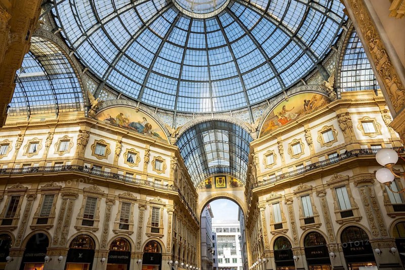 View of the Galleria Vittorio Emanuele with its many luxury shops in Milan on a sunny day, Milan, Italy