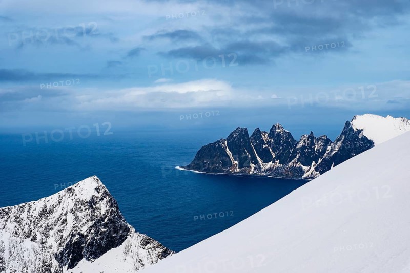 View from snow-capped peaks of Tungeneset, Senja Island, Troms, Norway