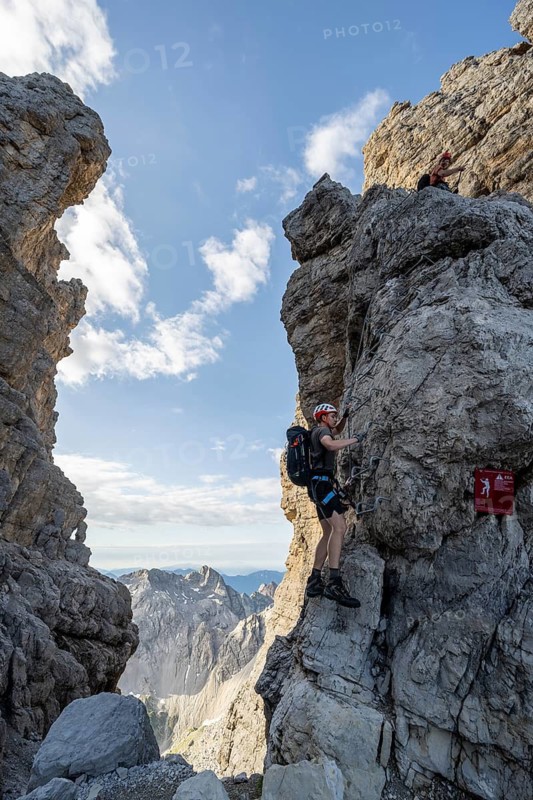 Mountaineer climbs at the start of the Via Ferrata Bocciere Centrale via Ferrata Bocciere Centrale at Bocca degli Armi, Brenta Mountains, Parco Naturale Brenta-Adamello, Trentino, Italy