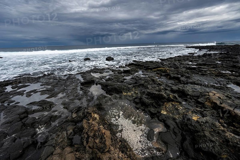 Rocky coast with volcanic stones, Playa de la Pequeña, Punta Usaje, Lanzarote, Canary Islands, Spain