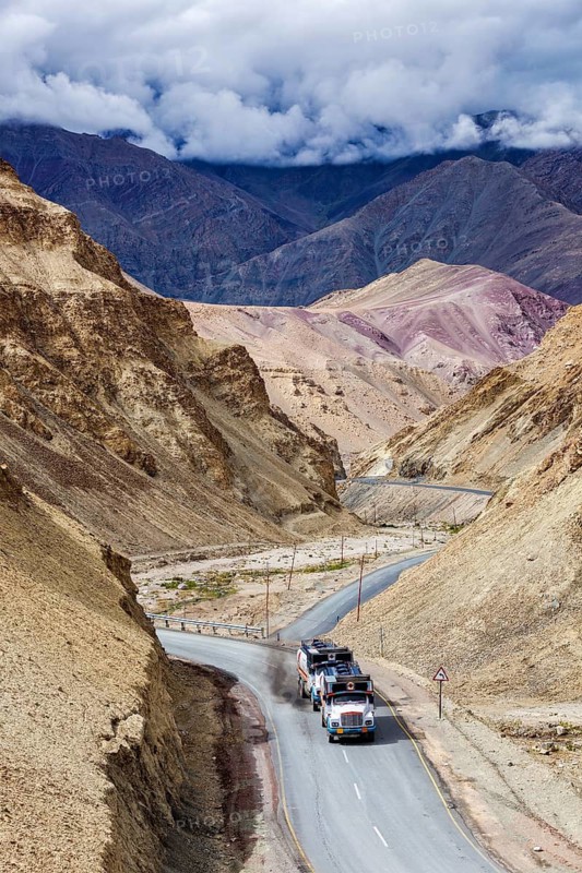 Indian lorry cistern fuel tanker trucks on NH-1 (Srinagar Leh national highway) in Himalayas. Ladakh, India