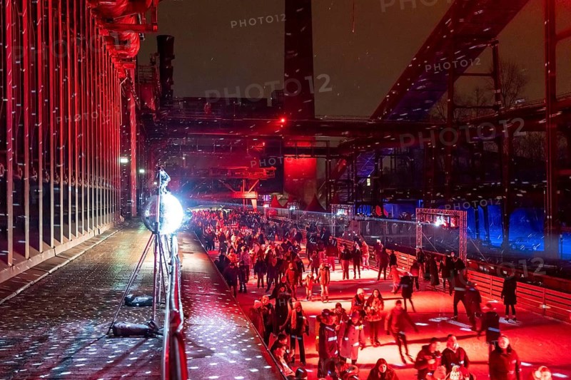 Ice rink at the Zollverein coking plant, ice skating with music and many lighting effects, Essen, North Rhine-Westphalia, Germany